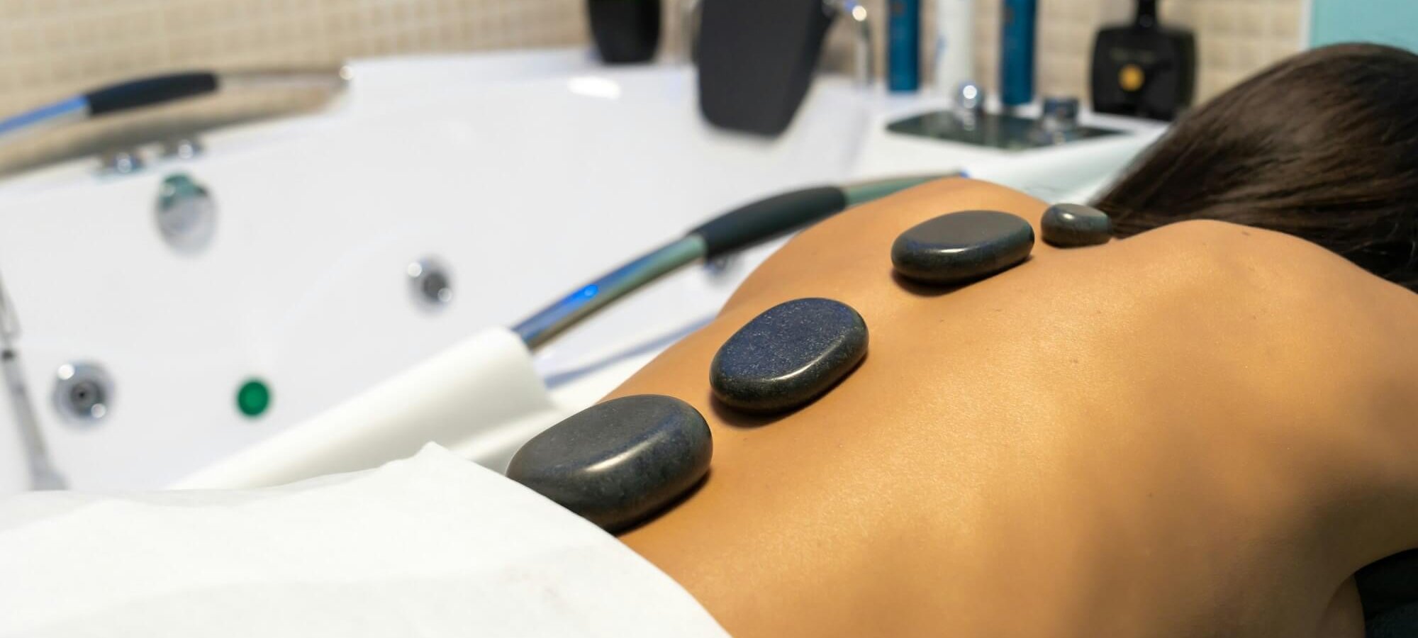 Efmale getting hot stone massage